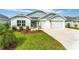 Charming single-story home with well-manicured lawn, three-car garage, and inviting curb appeal at 503 Verlander St, The Villages, FL 34762