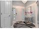 Elegant foyer with a chandelier, decorative mirror, stylish table, and a round rug creating a welcoming entrance at 503 Verlander St, The Villages, FL 34762