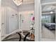 Elegant foyer with modern chandelier, decorative accents, and a glimpse into the Primary bedroom at 503 Verlander St, The Villages, FL 34762