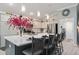 Open kitchen featuring island seating, stone countertops, and stainless steel appliances at 503 Verlander St, The Villages, FL 34762