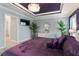 The main bedroom features a luxurious purple color scheme, decorative ceiling, and ample natural light at 503 Verlander St, The Villages, FL 34762