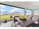 Enclosed patio featuring outdoor furniture and a beautiful view of the green backyard at 503 Verlander St, The Villages, FL 34762