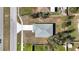 Birds eye view of the home. Showing the roof, the driveway, the street, and the lawn at 509 Marion Oaks Trail, Ocala, FL 34473