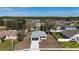 An aerial view of the home in its neighborhood. Surrounded by trees and other homes at 509 Marion Oaks Trail, Ocala, FL 34473