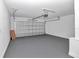 Clean, spacious garage with freshly painted walls and floor, with garage door open at 509 Marion Oaks Trail, Ocala, FL 34473