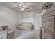 Bedroom features a window with blinds, ceiling fan, a neutral color scheme, and light carpet at 5902 Sw 112Th Place Rd, Ocala, FL 34476