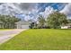 Charming one-story brick home featuring a well-manicured lawn and attached two car garage at 5902 Sw 112Th Place Rd, Ocala, FL 34476