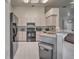 Efficient kitchen featuring black appliances, lots of lighting, and ample counter space at 5902 Sw 112Th Place Rd, Ocala, FL 34476