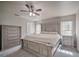 Spacious main bedroom with a king bed, a neutral color palette, and bright natural light at 5902 Sw 112Th Place Rd, Ocala, FL 34476