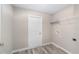 An airy laundry room with wood floors and a handy shelf for all your laundry needs at 5910 Sw 111Th Place Rd, Ocala, FL 34476