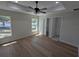 Spacious bedroom with tray ceiling, fan, and plenty of natural light at 6276 Nw 65 Nw Pl, Ocala, FL 34482