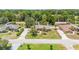 Aerial shot showcasing a beautiful single-story home with a green lawn and mature trees at 6279 Se 8Th Lane, Ocala, FL 34472
