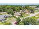 Birds-eye view of a charming single-story house surrounded by mature trees in a serene residential area at 6279 Se 8Th Lane, Ocala, FL 34472