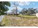 Expansive backyard enclosed by a pristine white fence, providing ample space for recreation and relaxation at 6279 Se 8Th Lane, Ocala, FL 34472