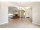 Open dining room with arched doorways into adjacent living areas and a view of a fireplace at 6279 Se 8Th Lane, Ocala, FL 34472