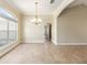 Open dining room featuring a contemporary chandelier and arched doorways, with natural light at 6279 Se 8Th Lane, Ocala, FL 34472