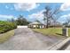 A spacious driveway and manicured landscaping add to the curb appeal of this single-story home at 6279 Se 8Th Lane, Ocala, FL 34472