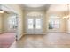Bright, spacious foyer boasts elegant double doors and arched windows letting in plenty of natural light at 6279 Se 8Th Lane, Ocala, FL 34472