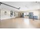 Spacious garage with epoxy flooring, ample storage cabinets, a work area, and natural light from the window at 6279 Se 8Th Lane, Ocala, FL 34472