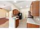 Bright open kitchen featuring wood cabinets, tiled backsplash, quartz countertops, and stainless steel appliances at 6279 Se 8Th Lane, Ocala, FL 34472