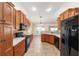 Well-lit kitchen with custom cabinetry, stone tile backsplash, quartz countertops, and stainless steel appliances at 6279 Se 8Th Lane, Ocala, FL 34472