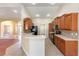 Open kitchen featuring wooden cabinets, modern countertops, tiled backsplash, and stainless steel appliances at 6279 Se 8Th Lane, Ocala, FL 34472
