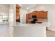 An open kitchen featuring wood cabinets, quartz countertops, breakfast bar, and stainless appliances at 6279 Se 8Th Lane, Ocala, FL 34472