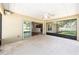 Covered screened lanai with backyard view, ceiling fan, and access to the interior of the home at 6279 Se 8Th Lane, Ocala, FL 34472