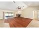 View of the expansive living room with fireplace and sliding glass doors to the lanai at 6279 Se 8Th Lane, Ocala, FL 34472