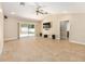 Open-concept living room with tile floors, ceiling fan, recessed lighting, and a sliding glass door at 6279 Se 8Th Lane, Ocala, FL 34472