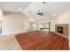Spacious living room features hardwood floors, fireplace, and view to the outdoor patio at 6279 Se 8Th Lane, Ocala, FL 34472