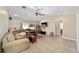 A spacious living room features a ceiling fan and sliding glass door at 6279 Se 8Th Lane, Ocala, FL 34472