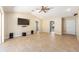 Spacious living room featuring tile floors, a ceiling fan, recessed lights, and neutral wall color at 6279 Se 8Th Lane, Ocala, FL 34472