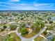Charming single-story home nestled on a tree-lined street in a peaceful residential neighborhood with lush landscaping and blue skies at 6450 Sw 83Rd Ln, Ocala, FL 34476