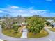 Aerial of the home with a landscaped front yard and mature trees within the community at 6450 Sw 83Rd Ln, Ocala, FL 34476