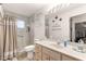 Bathroom featuring a shower with tiled walls and vanity sink at 6450 Sw 83Rd Ln, Ocala, FL 34476
