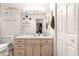 Bathroom featuring vanity with mirror and towel racks at 6450 Sw 83Rd Ln, Ocala, FL 34476