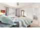 Bright bedroom with twin beds, dresser, and window offering natural light at 6450 Sw 83Rd Ln, Ocala, FL 34476