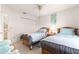 Inviting bedroom with two twin beds, ceiling fan, closet and serene decor at 6450 Sw 83Rd Ln, Ocala, FL 34476