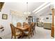 Charming dining room with a chandelier and natural light, perfect for Gathering gatherings at 6450 Sw 83Rd Ln, Ocala, FL 34476