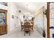 Bright dining area with a chandelier and natural light, seamlessly connected to the kitchen at 6450 Sw 83Rd Ln, Ocala, FL 34476