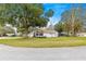 Charming home with large front yard and mature trees offers great curb appeal at 6450 Sw 83Rd Ln, Ocala, FL 34476
