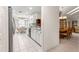 Well-lit kitchen featuring white cabinetry, granite countertops, and modern appliances at 6450 Sw 83Rd Ln, Ocala, FL 34476