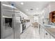 Contemporary kitchen boasting stainless steel appliances, granite counters, and ample cabinet space at 6450 Sw 83Rd Ln, Ocala, FL 34476
