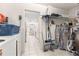 Laundry room with washer, dryer, shelving and tile floor at 6450 Sw 83Rd Ln, Ocala, FL 34476