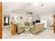 Bright living room featuring vaulted ceilings, a ceiling fan, and comfortable seating at 6450 Sw 83Rd Ln, Ocala, FL 34476