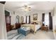 Comfortable main bedroom with a ceiling fan and carpeted floor at 6450 Sw 83Rd Ln, Ocala, FL 34476