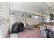 Enclosed porch with lattice screens, an outdoor grill and patio furniture at 6450 Sw 83Rd Ln, Ocala, FL 34476