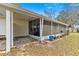 Enclosed screened patio offers outdoor living space perfect for relaxation and entertaining at 6450 Sw 83Rd Ln, Ocala, FL 34476