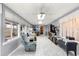 Bright sunroom with ample windows, tile flooring, and comfortable seating at 6450 Sw 83Rd Ln, Ocala, FL 34476